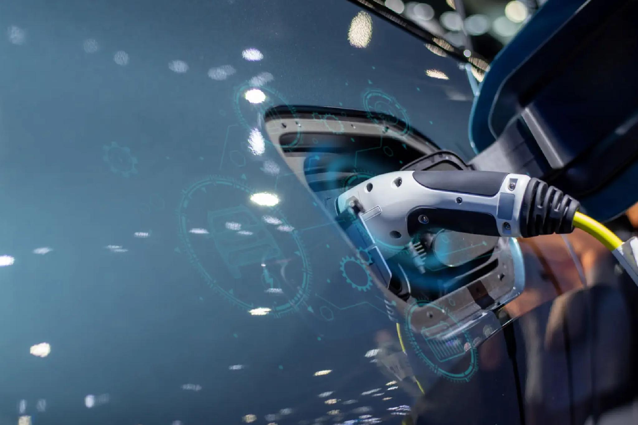 Electric vehicle charging with a plugged-in charging cable, shown close-up against a blurred background with digital interface graphics overlay.